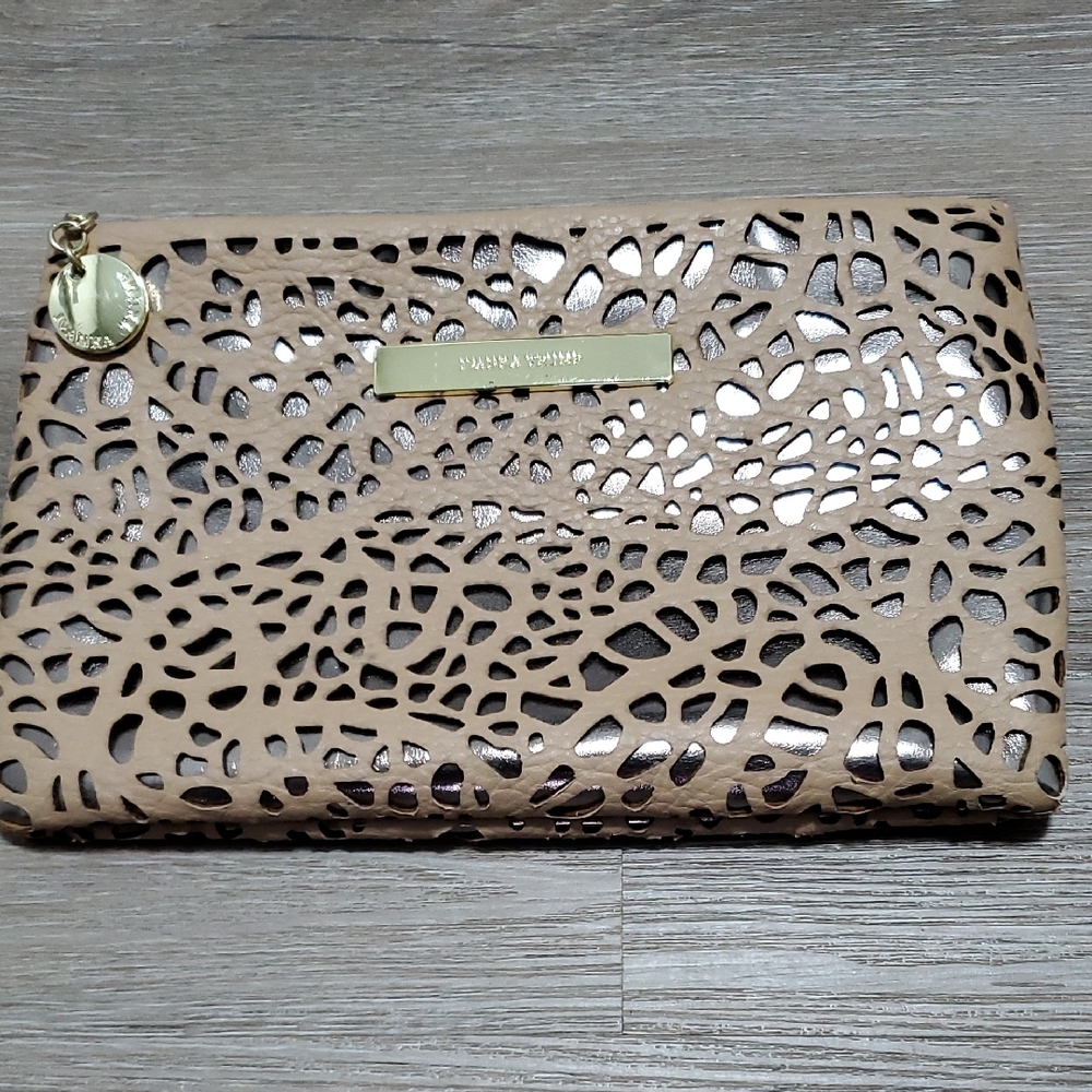Tan Clutch with Intricate Cutout Design and Flap Closure